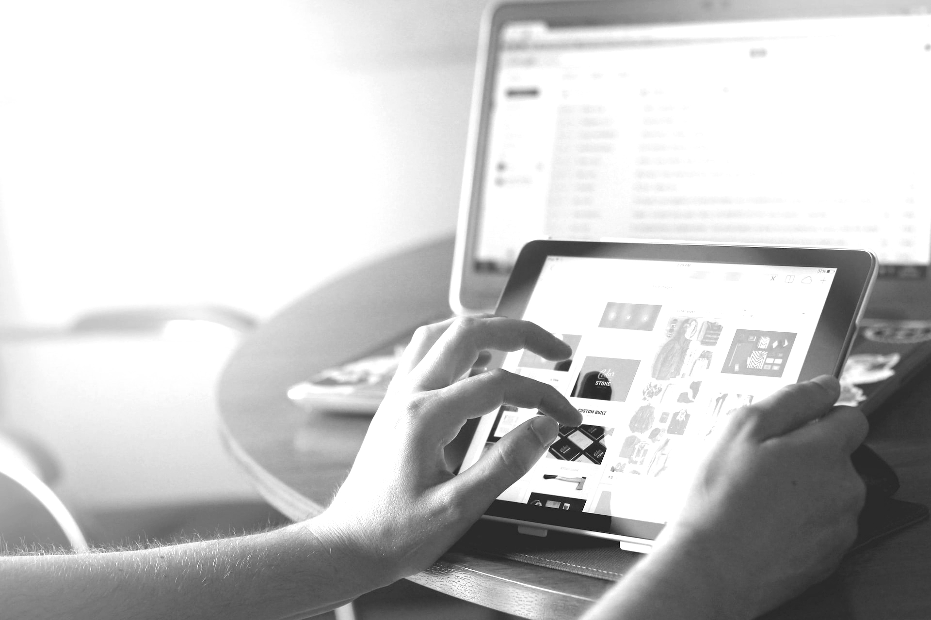 person holding black iPad